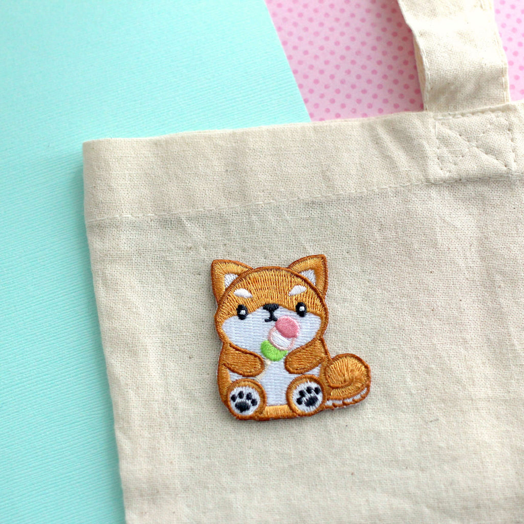 Shiba Inu holding Dango Embroidered Patch. Dog Iron-On Patch