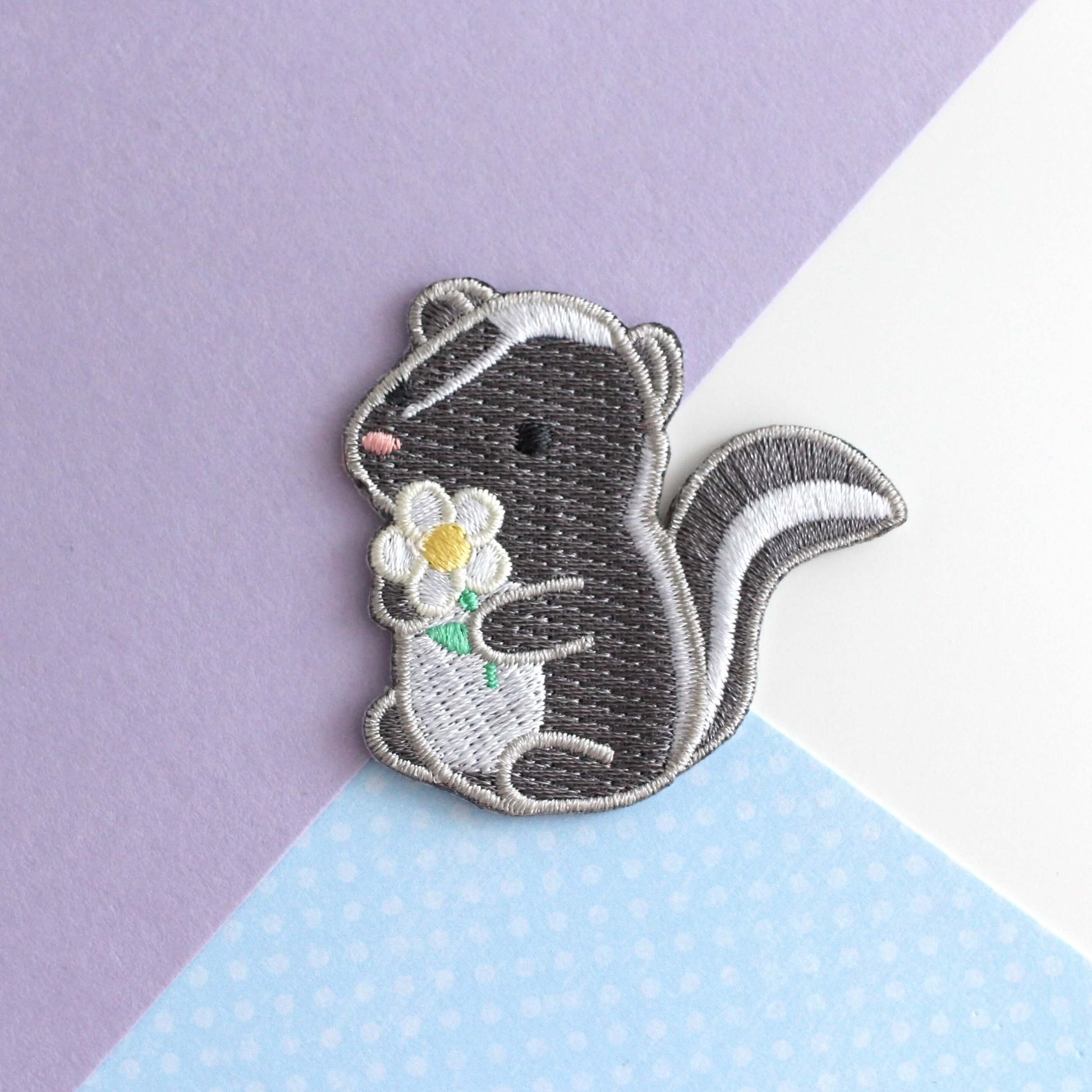 Skunk and Daisy Embroidered Iron-On Patch