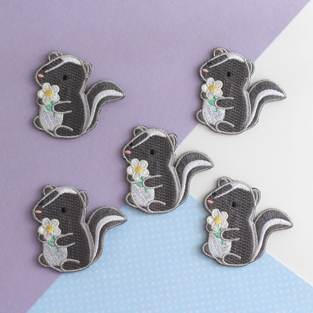 Skunk and Daisy Embroidered Iron-On Patch