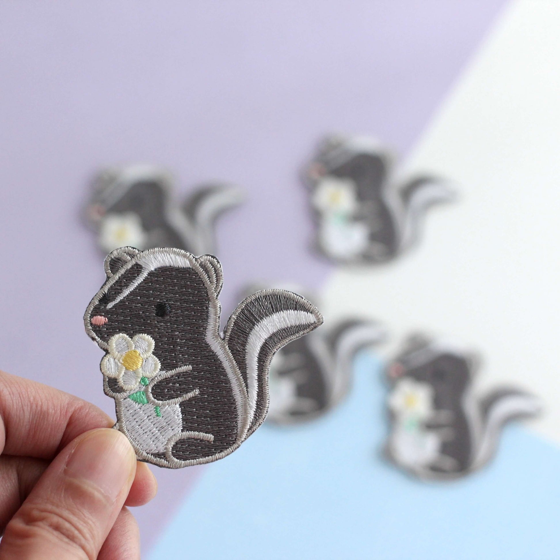 Skunk and Daisy Embroidered Iron-On Patch