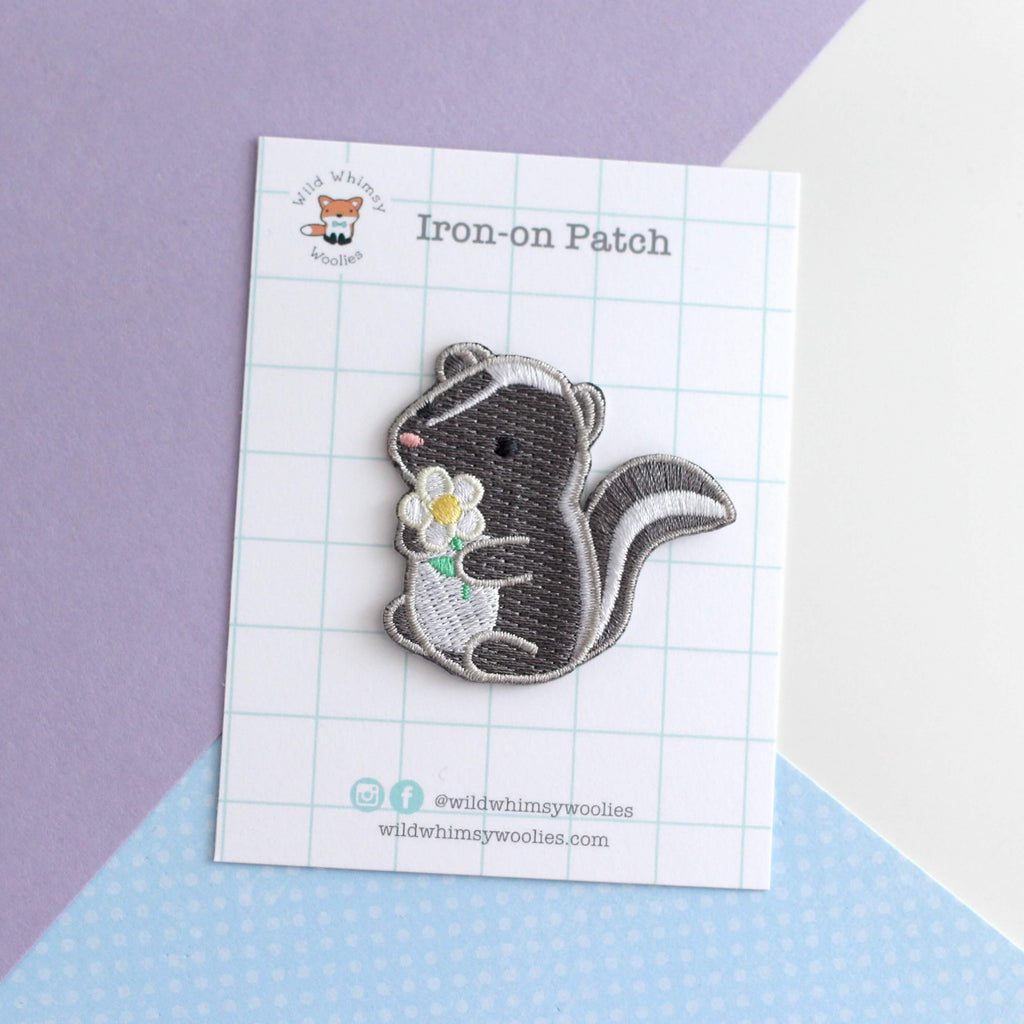 Skunk and Daisy Embroidered Iron-On Patch