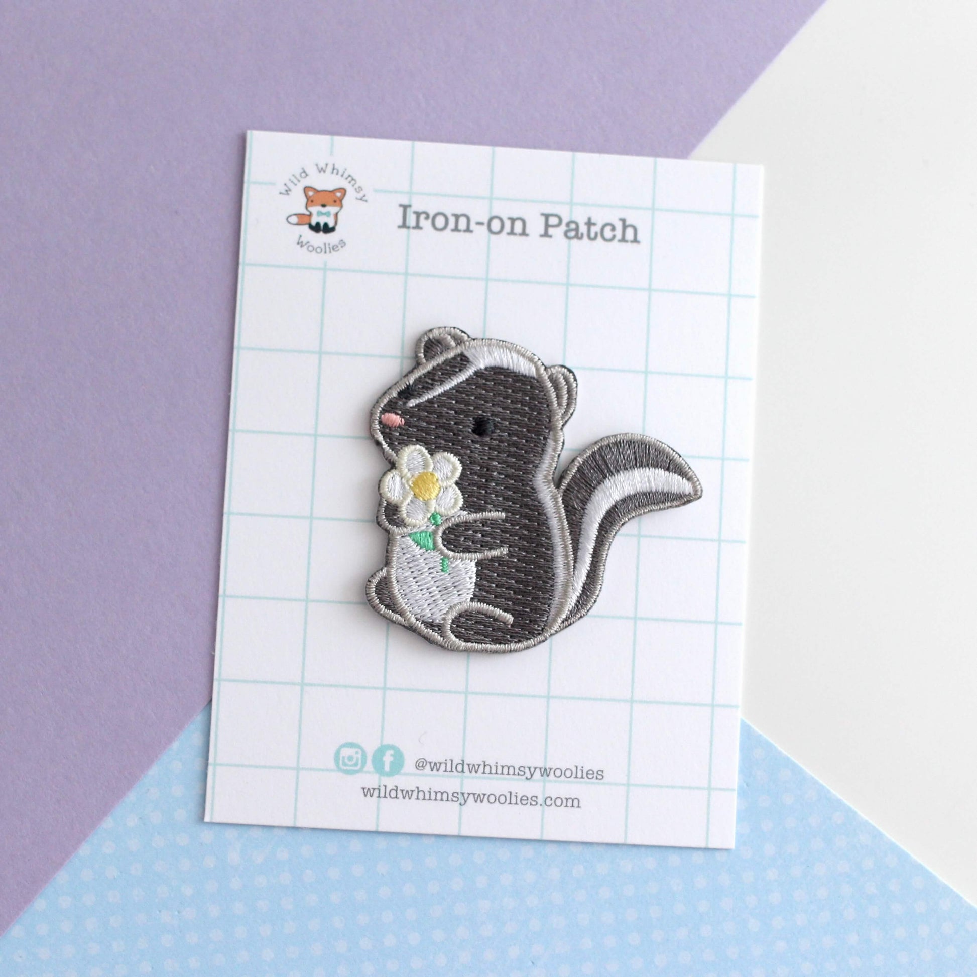 Skunk and Daisy Embroidered Iron-On Patch