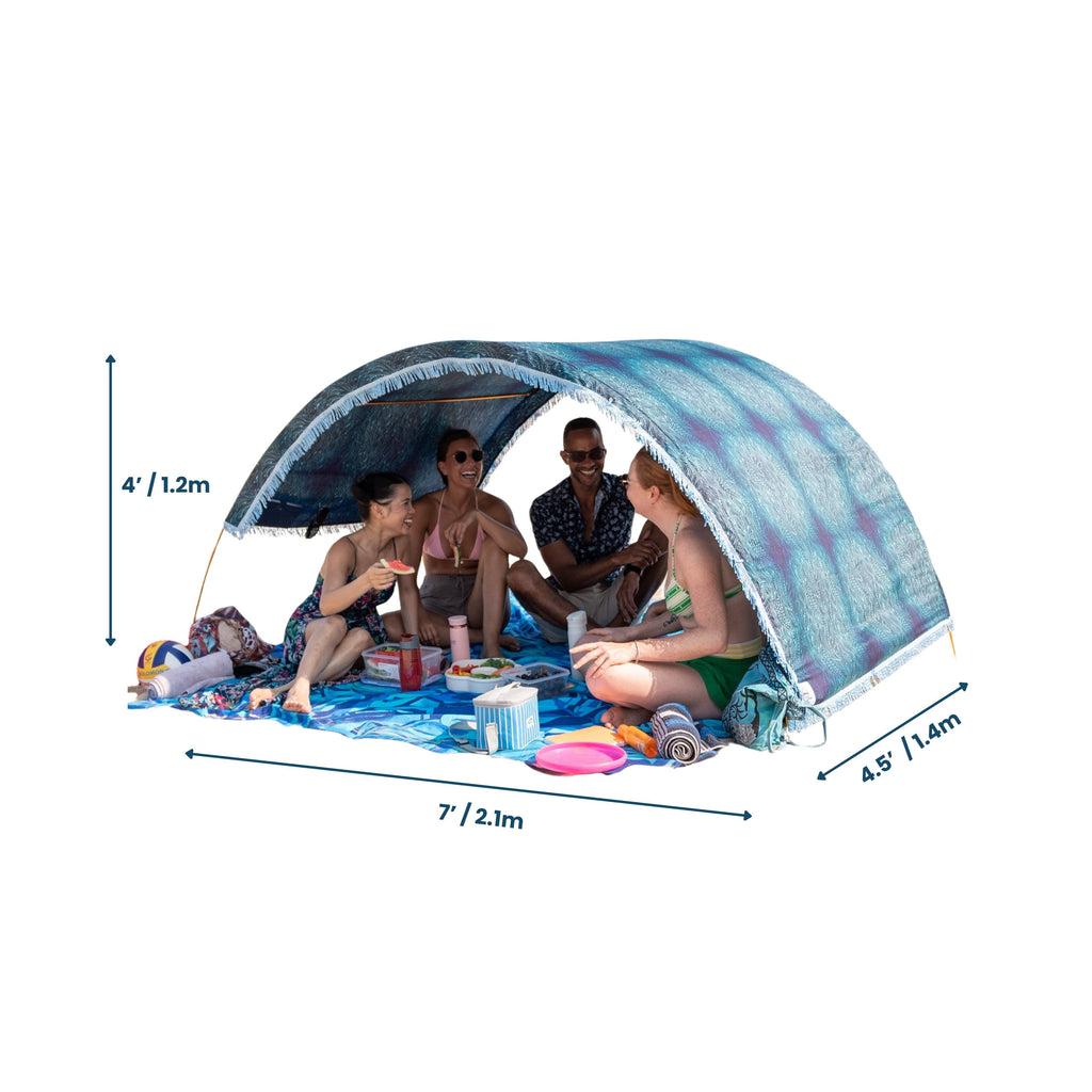 Suniela portable beach cabana with Ocean Waves cotton canopy shown with dimensions, seating a group on a white background