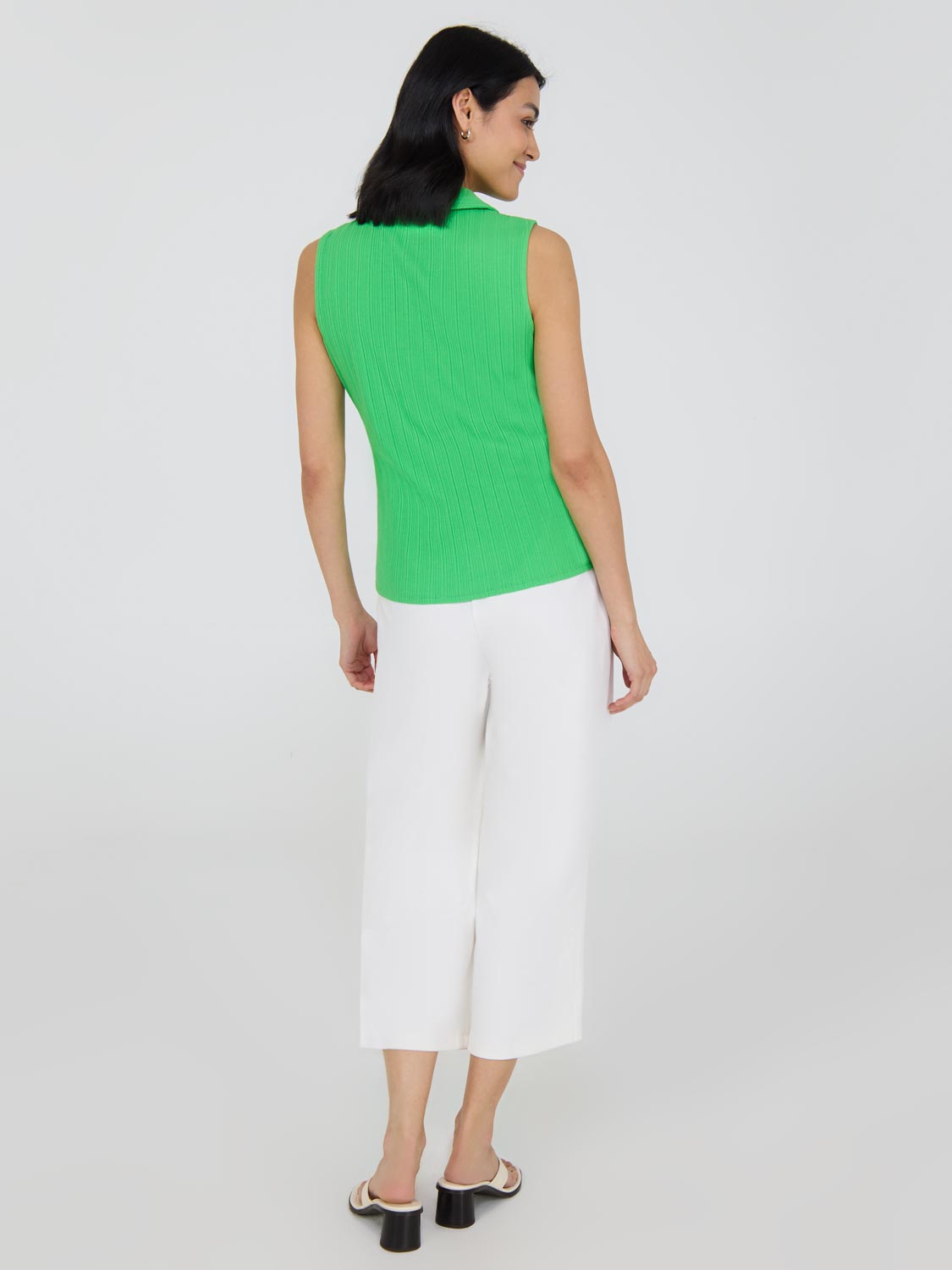 Polo sans manches à demi-zip