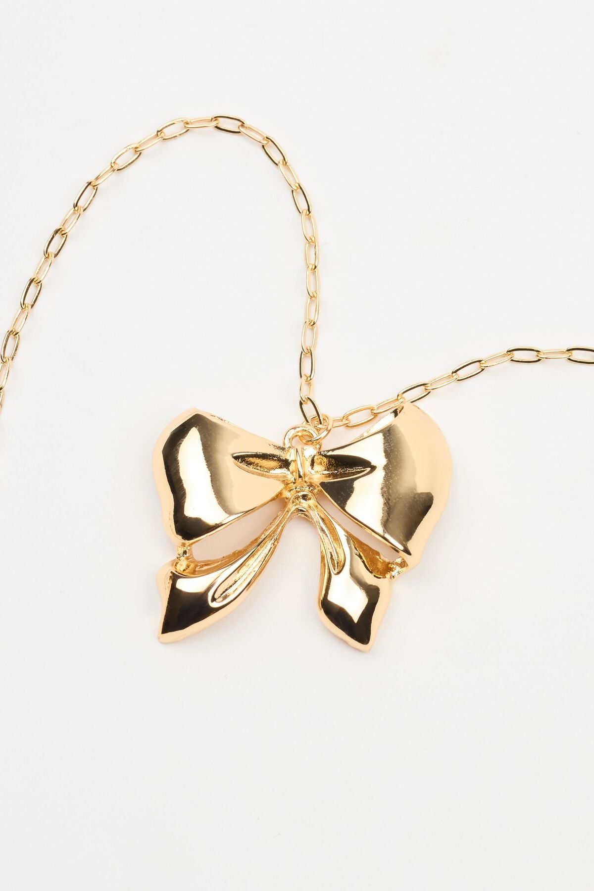 Collier nœud en métal surdimensionné