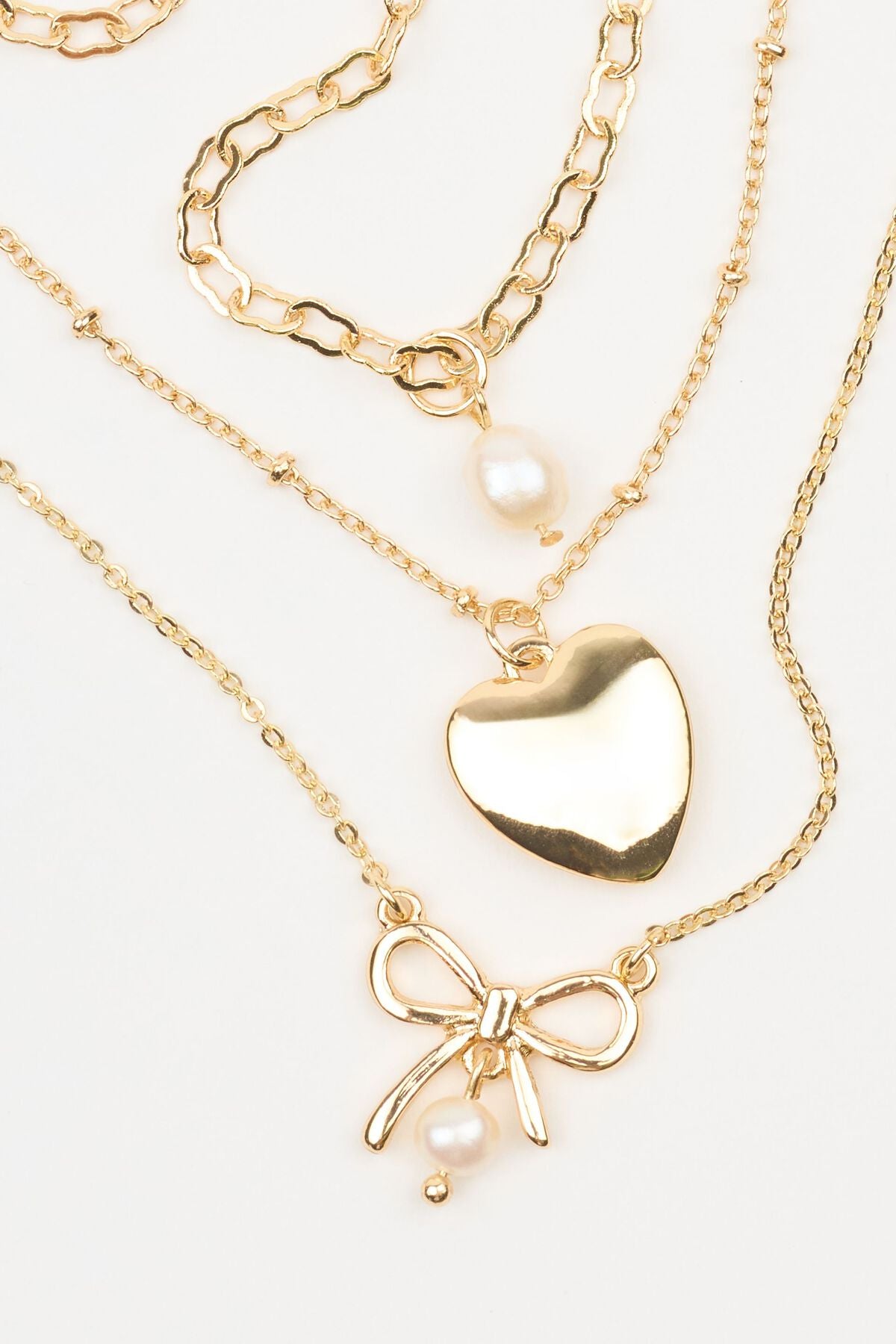 Ensemble de 3 colliers nœud, perle et cœur