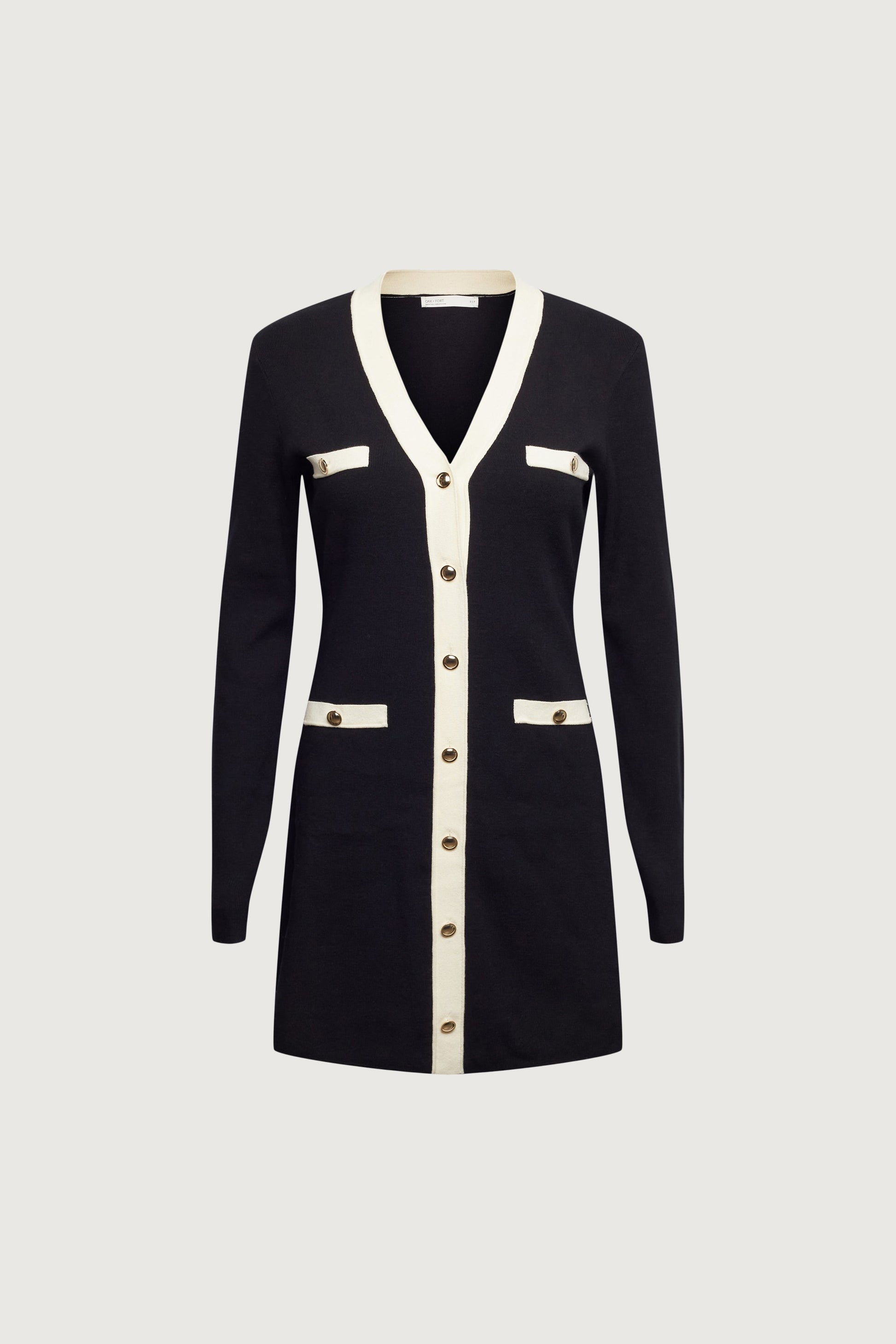 MINI-ROBE EN MAILLE À BORDURES CONTRASTÉES ET BOUTONNÉES SUR LE DEVANT
