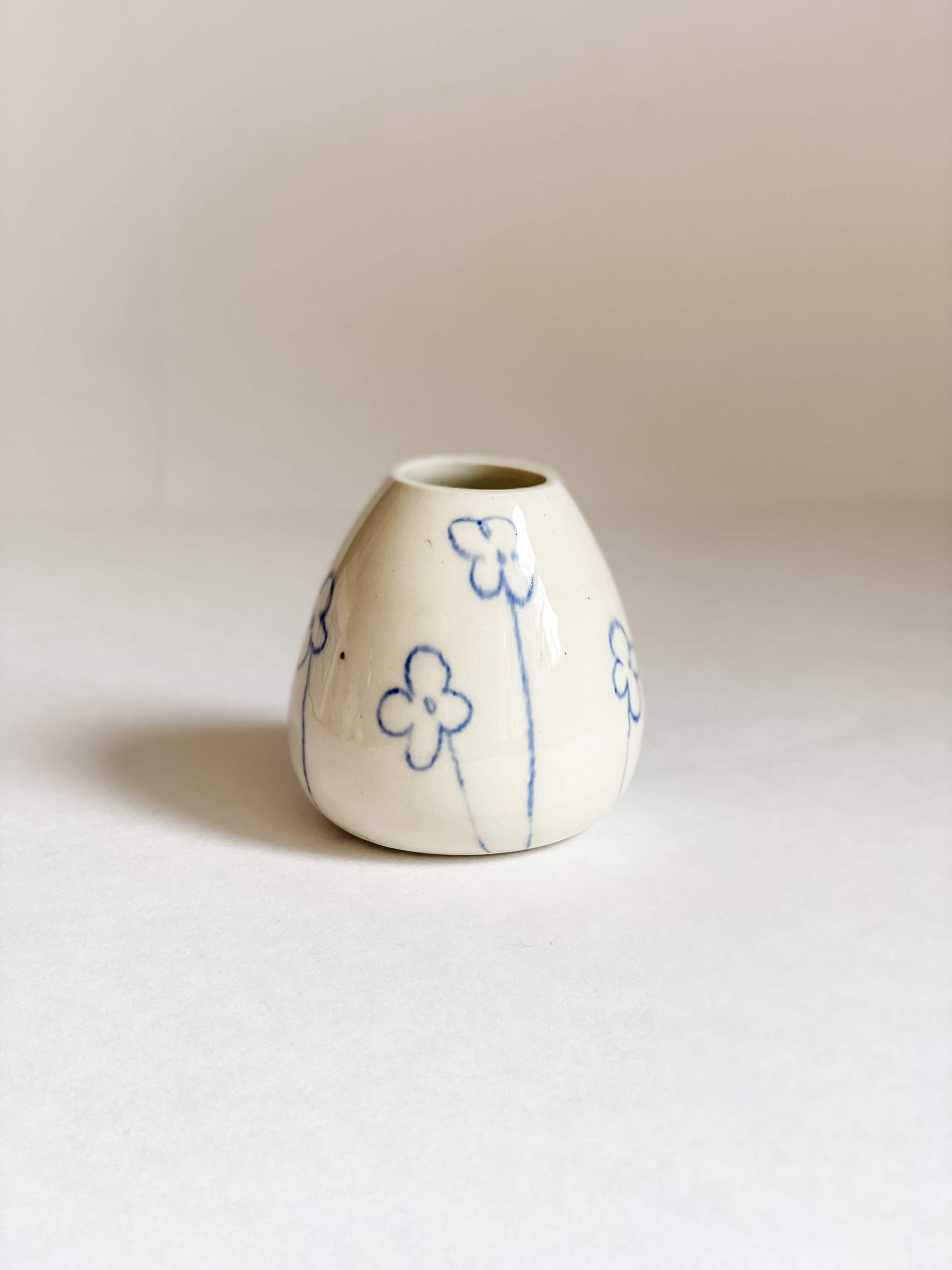 handmade pottery white porcelain bud vase hand drawn blue flowers