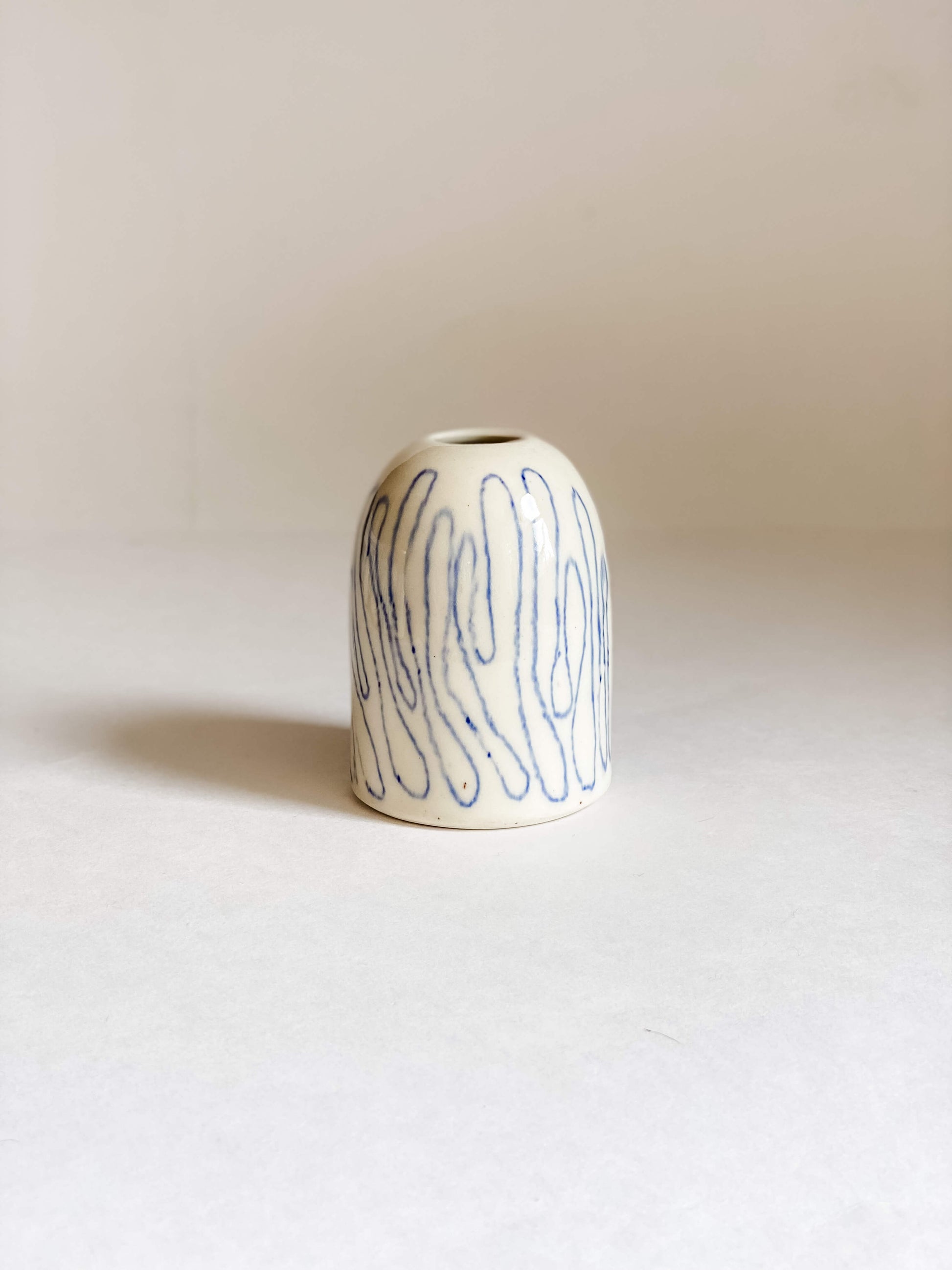 handmade pottery white porcelain bud vase hand drawn blue topographic style lines