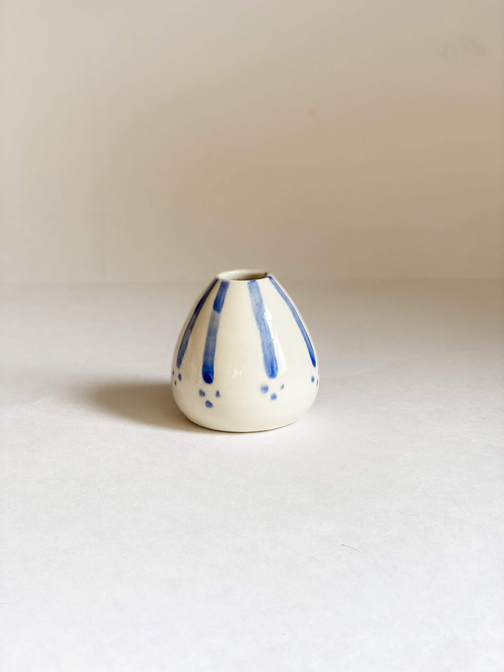 handmade pottery white porcelain bud vase hand painted blue stripes and dots