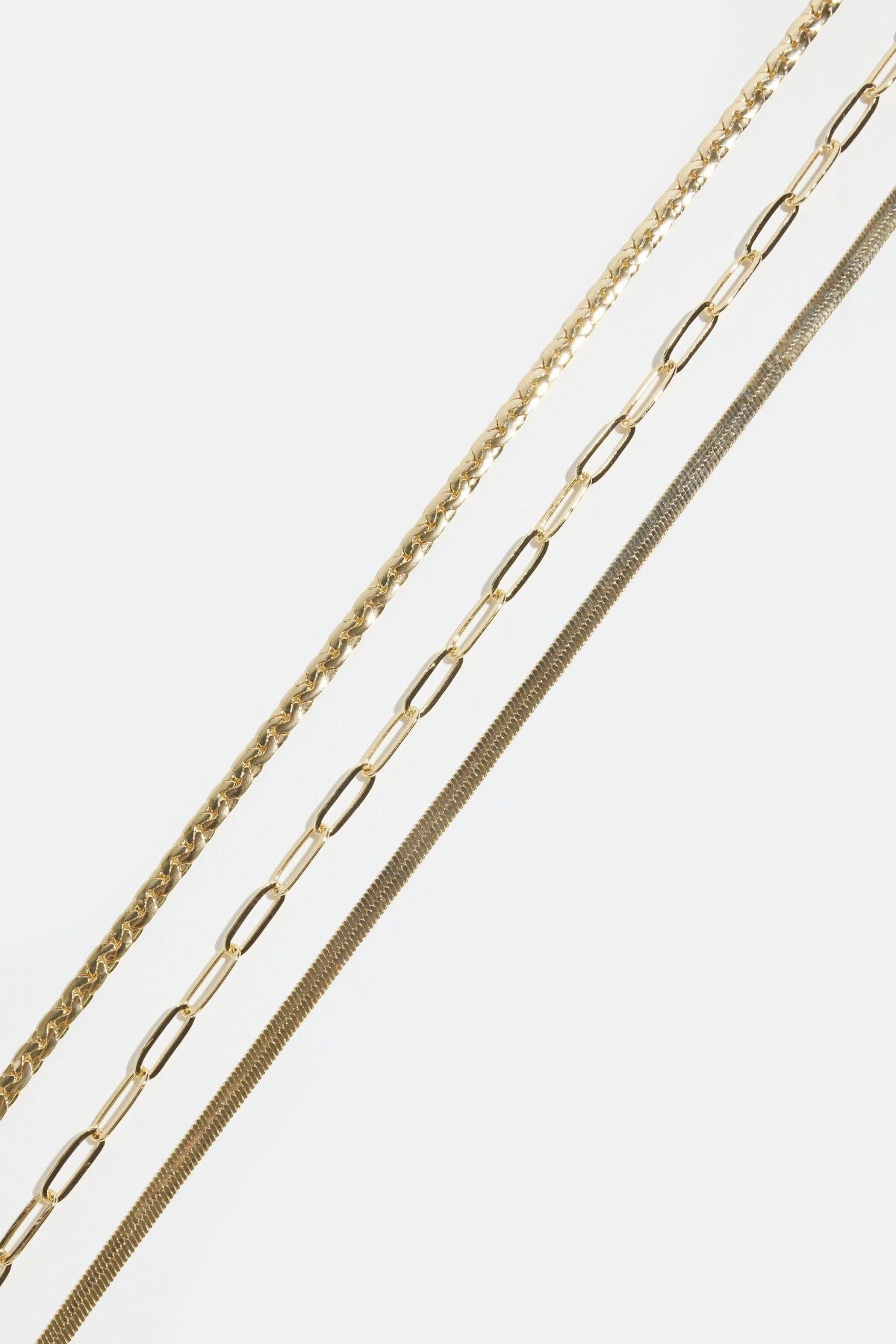 Collier à plusieurs niveaux avec trombone, serpent et chaîne plate