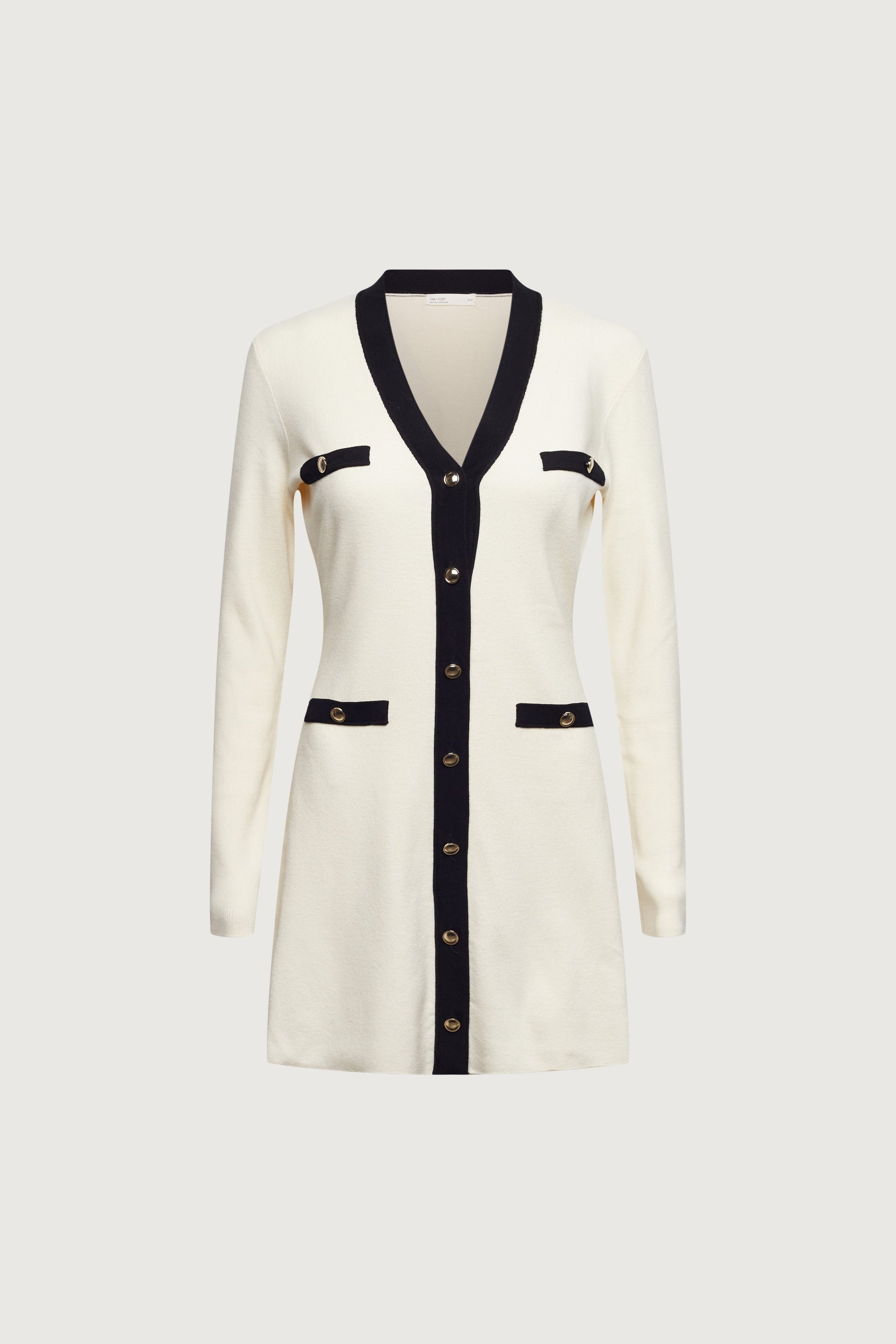 MINI-ROBE EN MAILLE À BORDURES CONTRASTÉES ET BOUTONNÉES SUR LE DEVANT