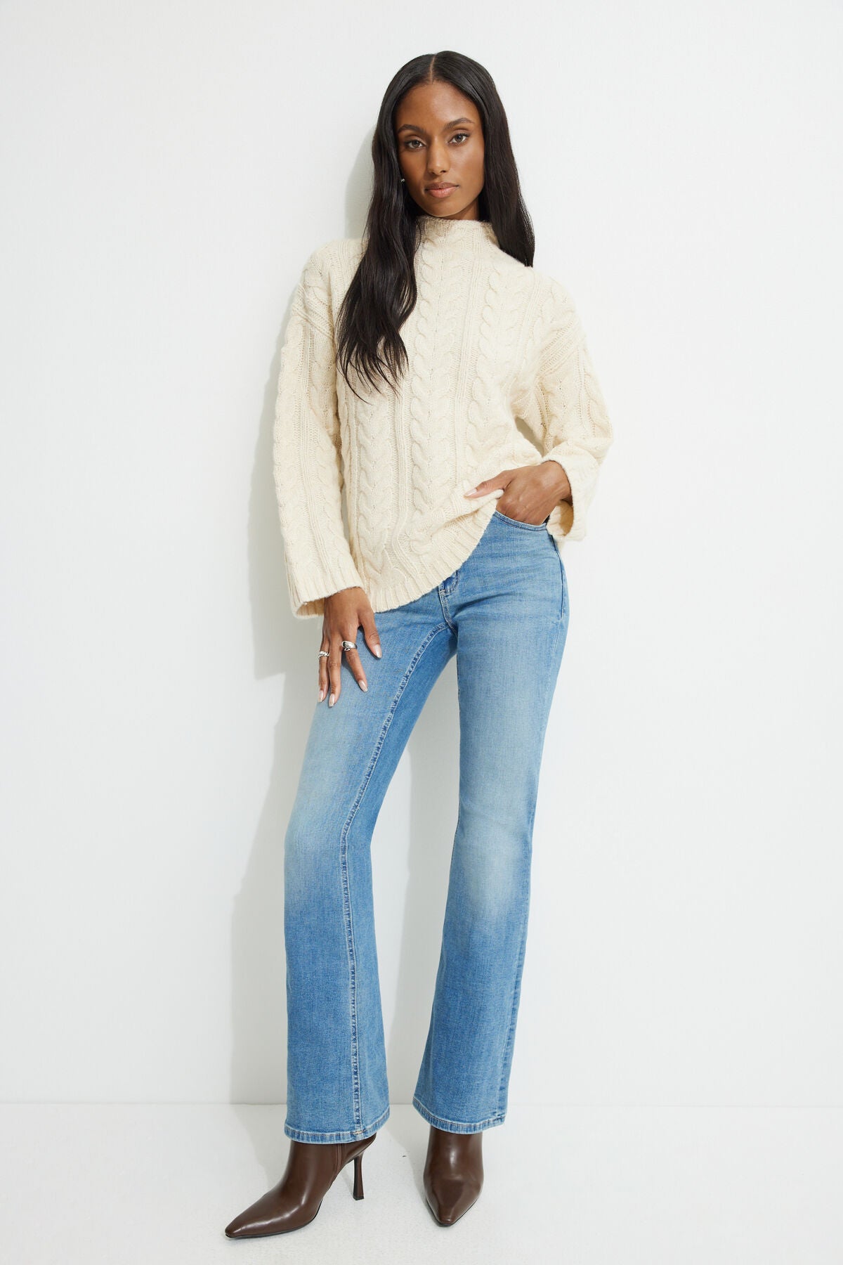 Pull à col montant en maille torsadée