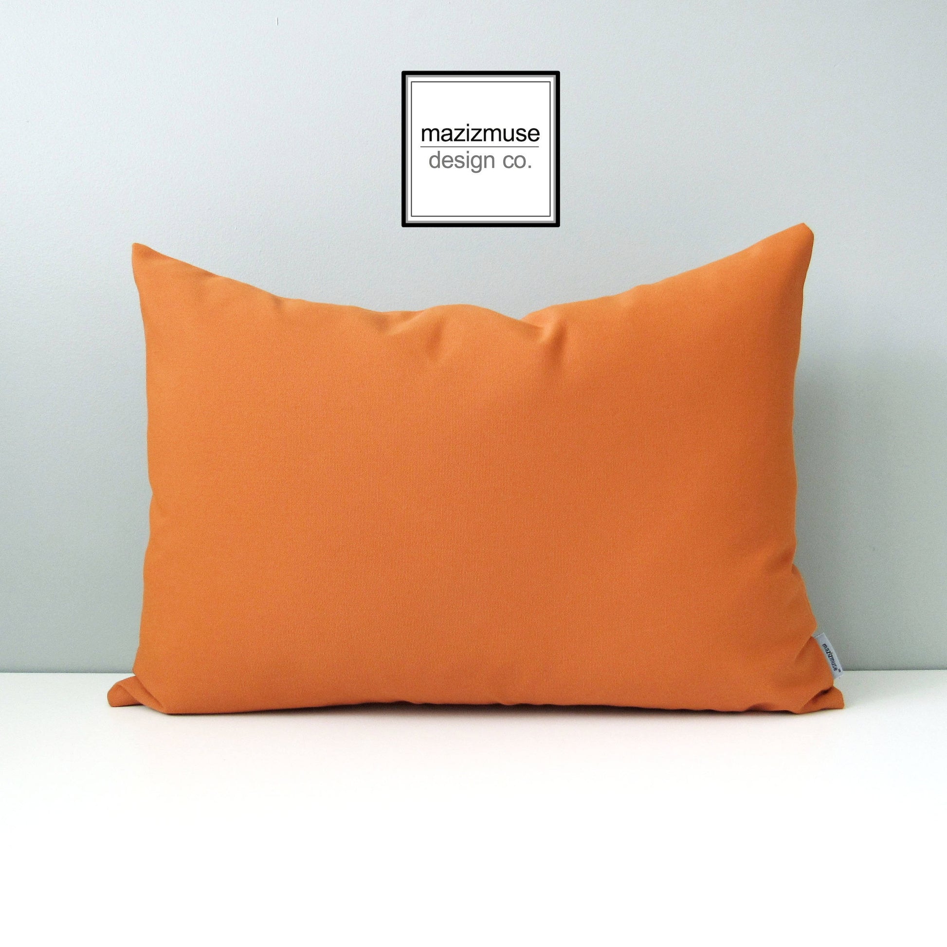 Housse de coussin d'extérieur décorative orange en tissu Sunbrella® de Toscane