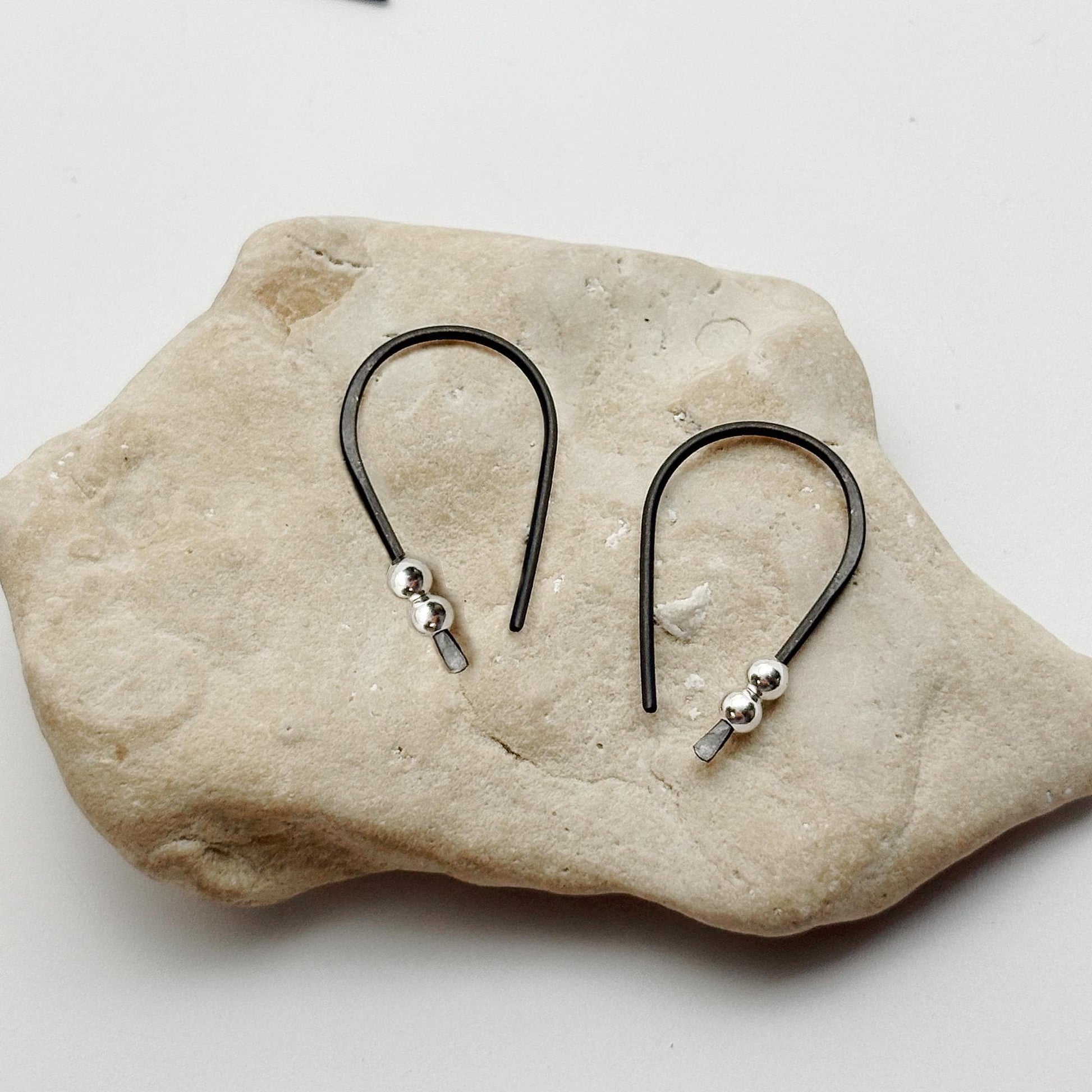 Black Niobium hoop earrings. Small 3/4" hoops. Silver accent beads. Hypoallergenic