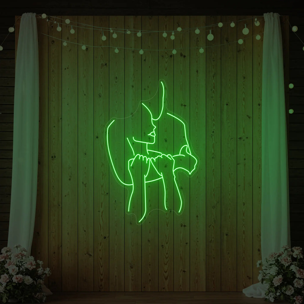 Enseigne lumineuse « Amoureux enlacés »