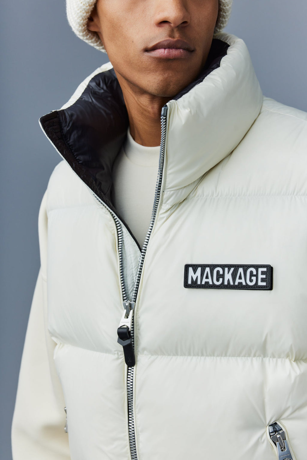 KANE lustrous light down vest with funnel collar