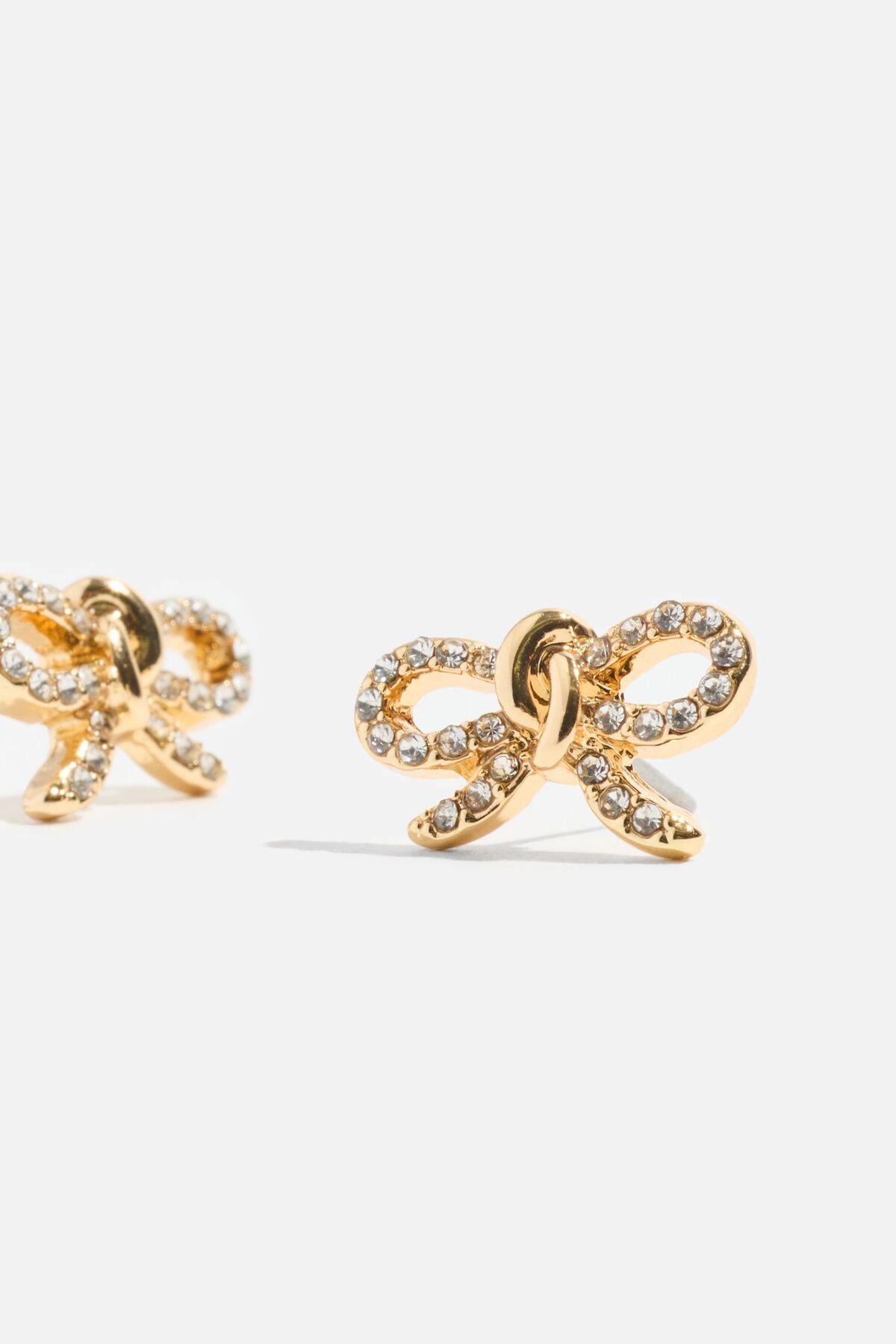 Boucles d'oreilles en forme de nœud noué avec pierres précieuses