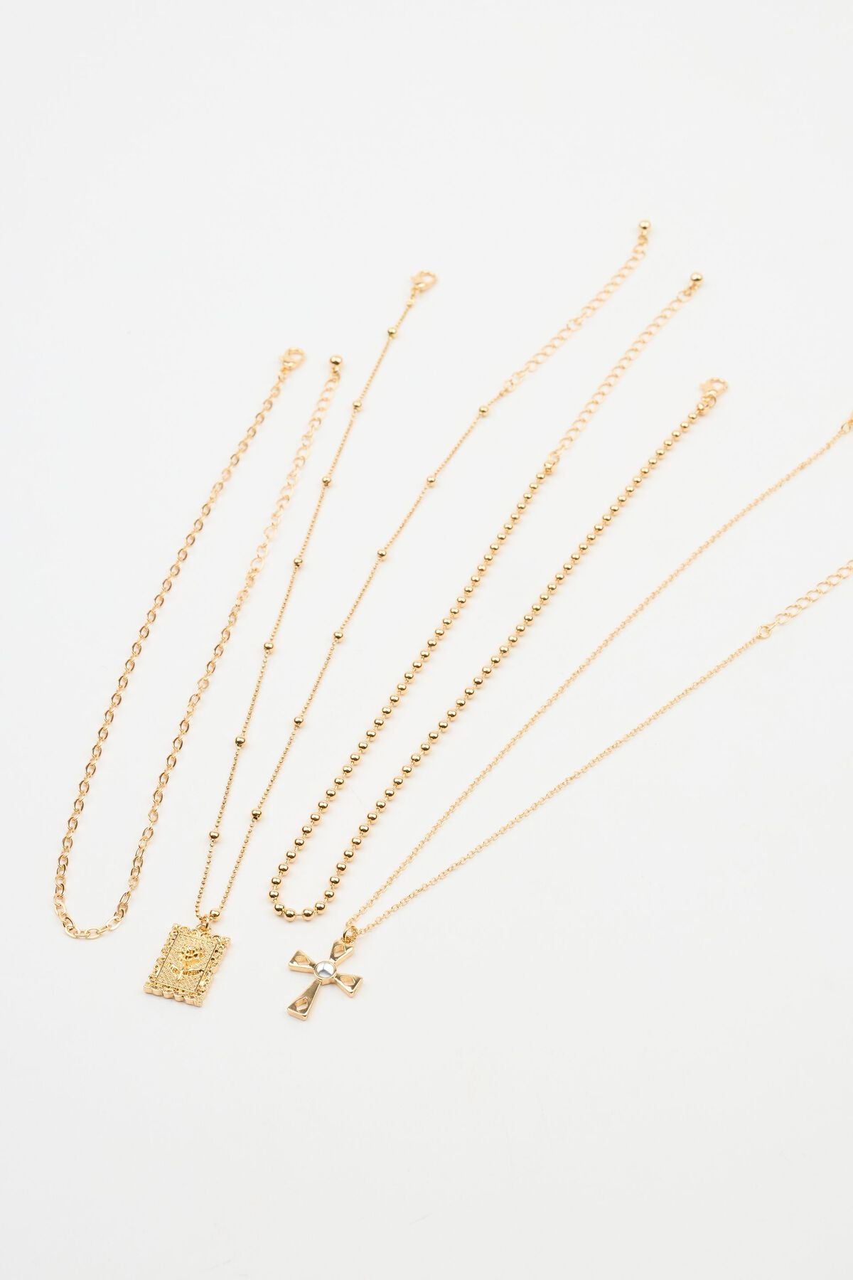 Ensemble de 4 colliers avec pendentif croix et rose