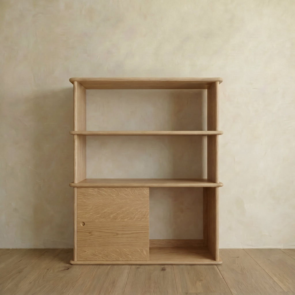 Sliding door bookcase in white oak