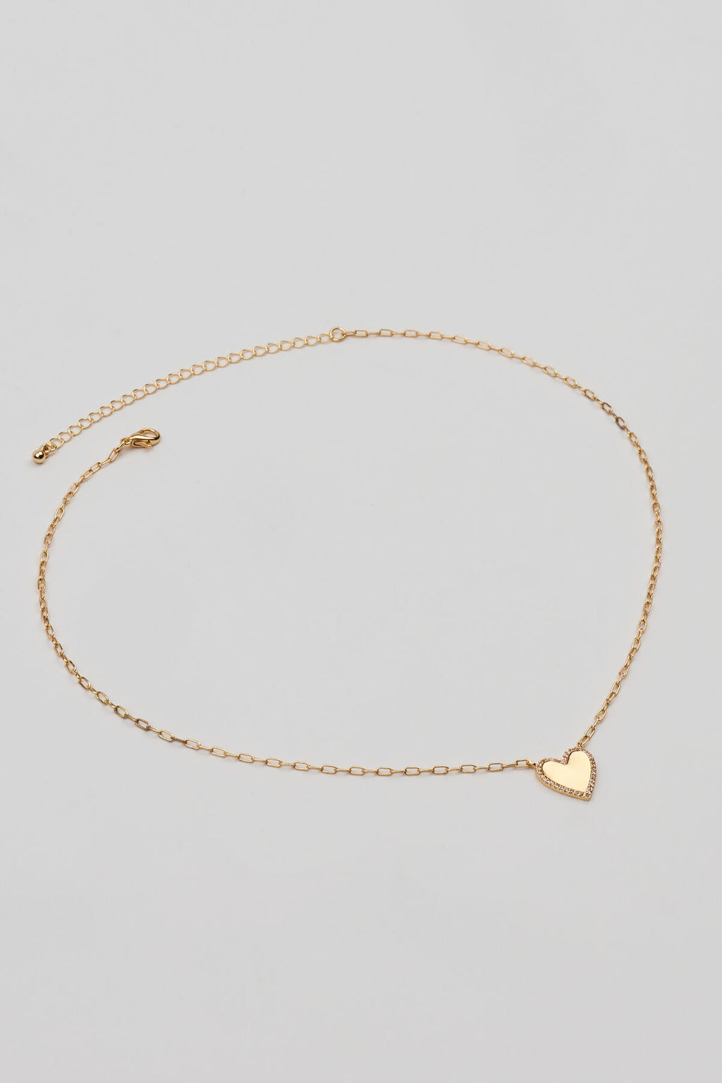 Collier chaîne trombone cœur serti de pierres précieuses