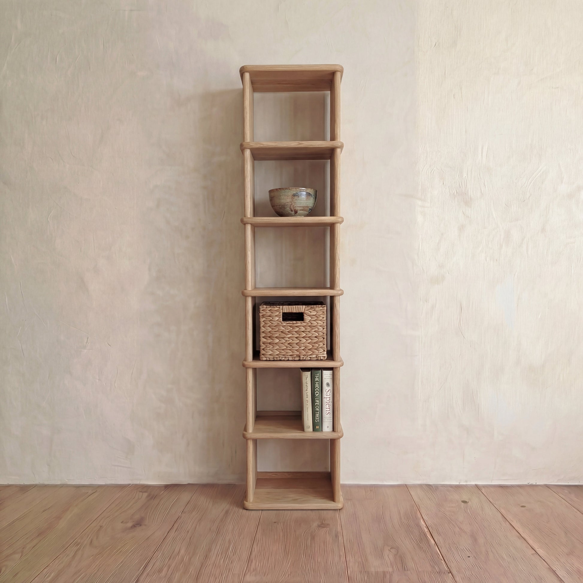 Tall narrow bookcase in white oak