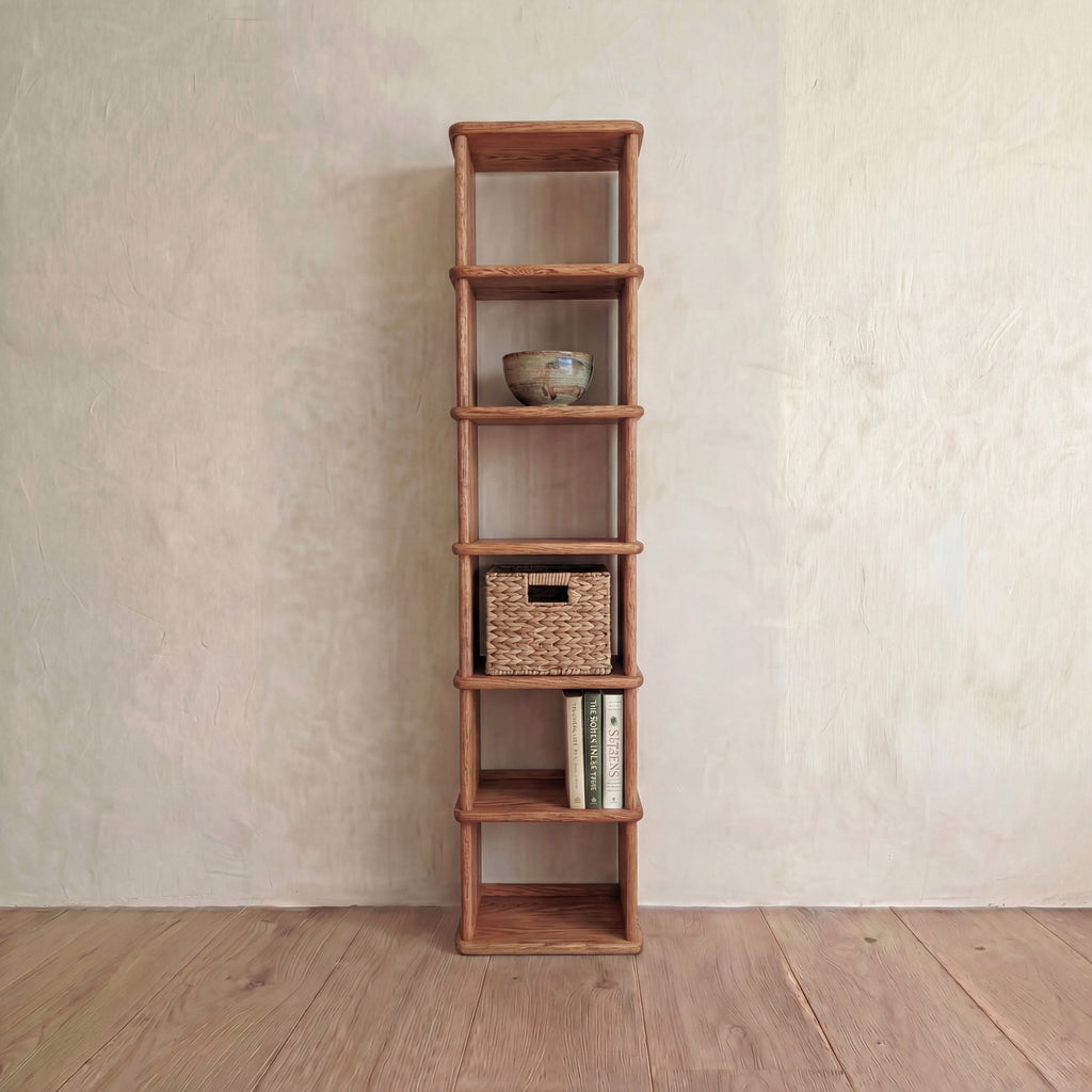 Tall narrow bookcase in red oak