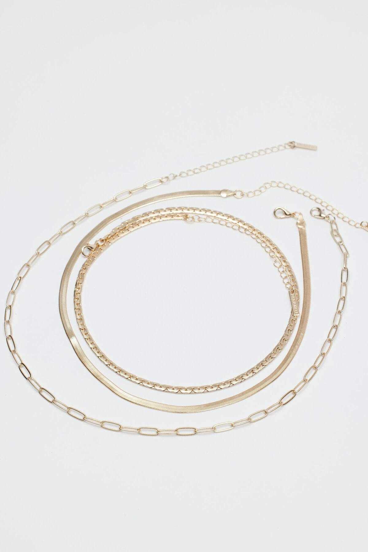 Collier à plusieurs niveaux avec trombone, serpent et chaîne plate